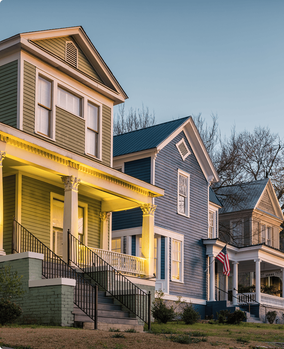 Colorful historic houses at sunset.